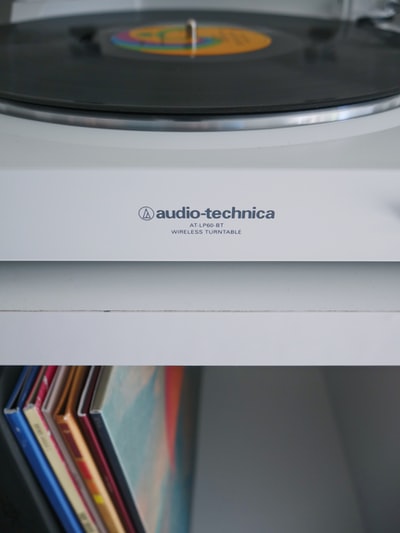 White audio Technica wireless wheel near the vinyl sleeve
